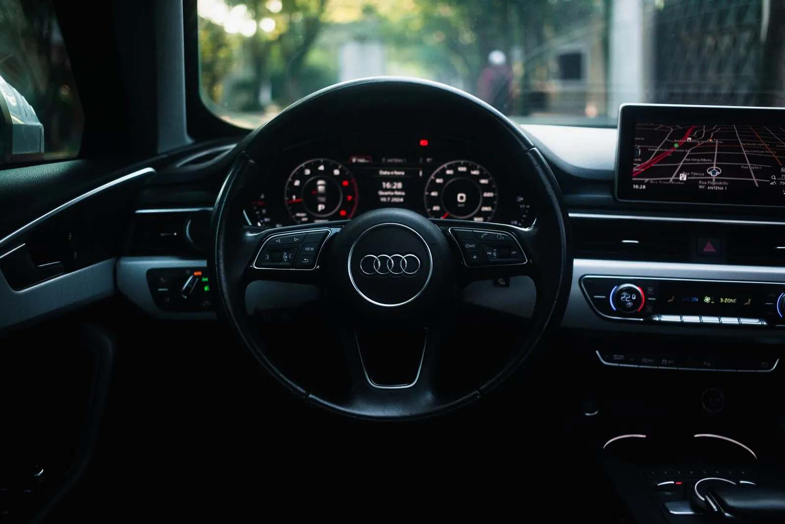 Audi dashboard and steering wheel, daylight interior view